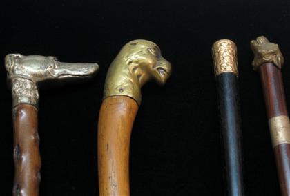 Appraisal: Group of four walking sticks with animal head and sterling