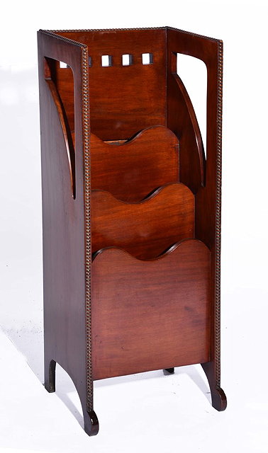 Appraisal: AN EARLY TH CENTURY MAHOGANY GLASGOW SCHOOL MAGAZINE RACK with