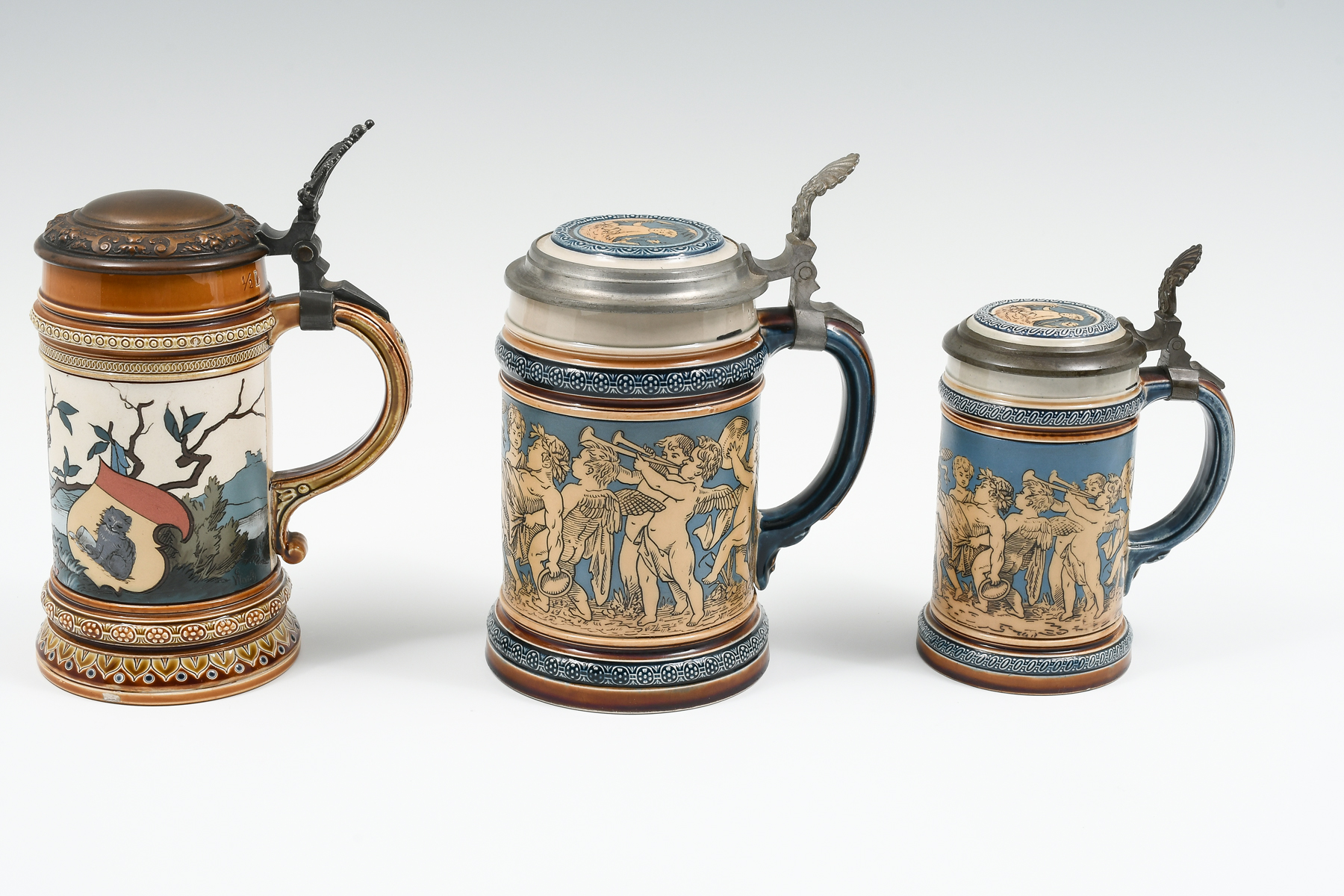 Appraisal: PC METTLACH FIGURAL CHERUBIC STEINS Comprising - Mettlach Etched L