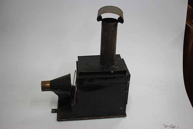 Appraisal: A VICTORIAN MAGIC LANTERN in a fitted case together with