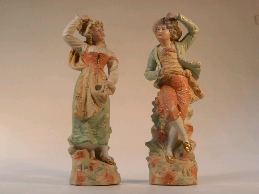 Appraisal: A pair of German bisque polychrome figures of a boy