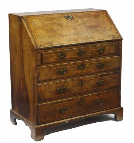 Appraisal: An early th century walnut crossbanded and boxwood strung bureau