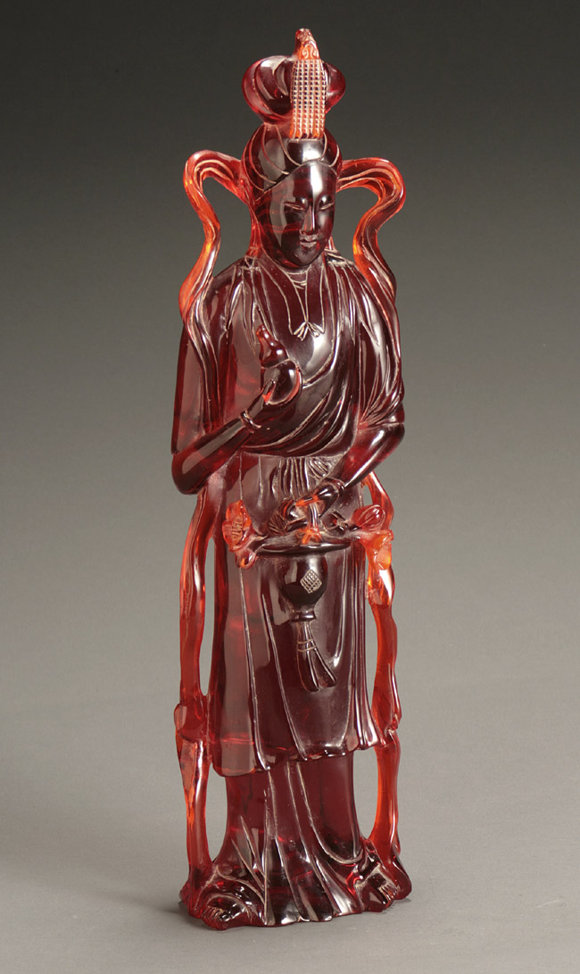 Appraisal: Chinese Cherry-Red Amber Figure of Guanyin Last Half th Century