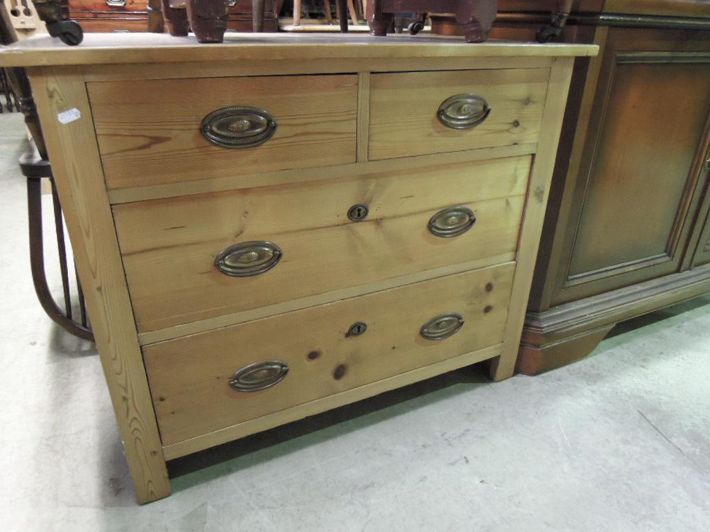 Appraisal: A stripped continental pine chest fitted with two long and