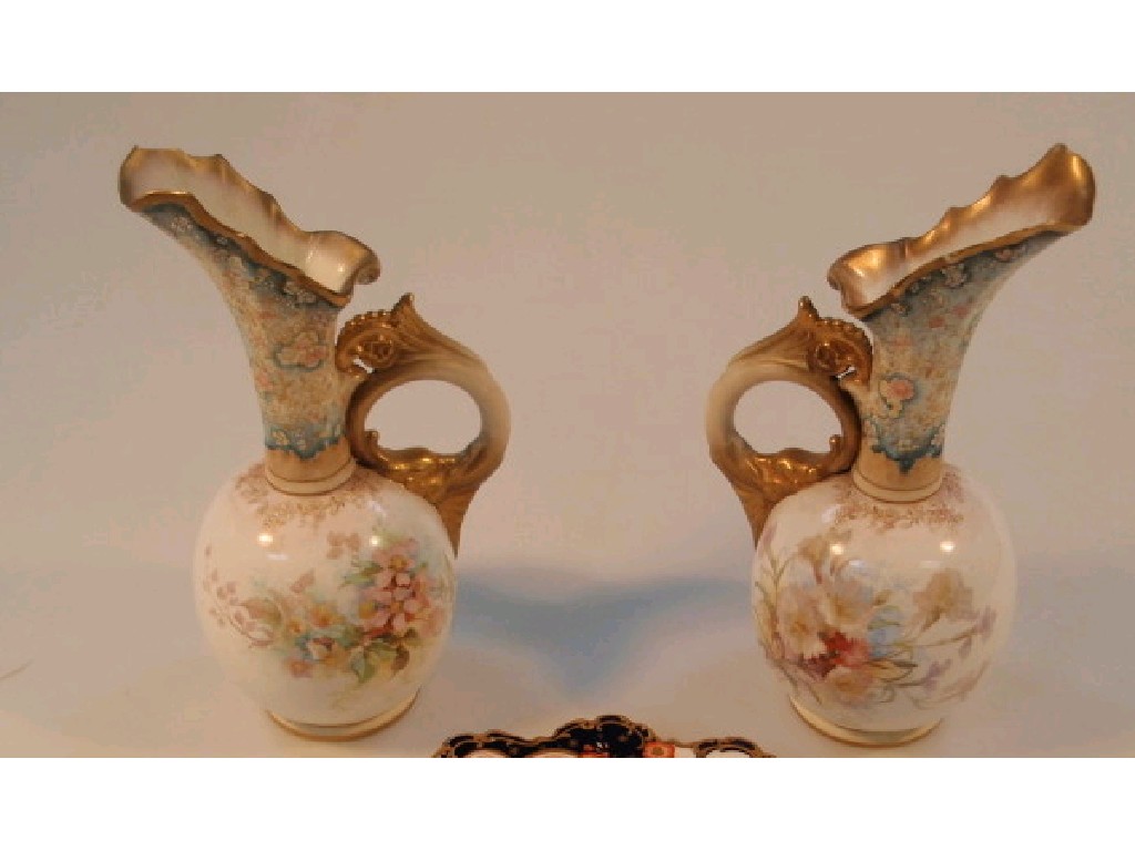 Appraisal: A pair of Doulton Burslem ewers the circle bodies painted