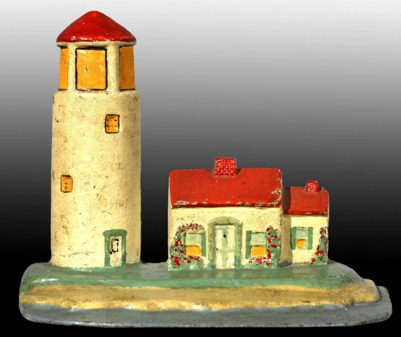 Appraisal: Cast Iron Lighthouse Doorstop Description Made by National Foundry Depicts