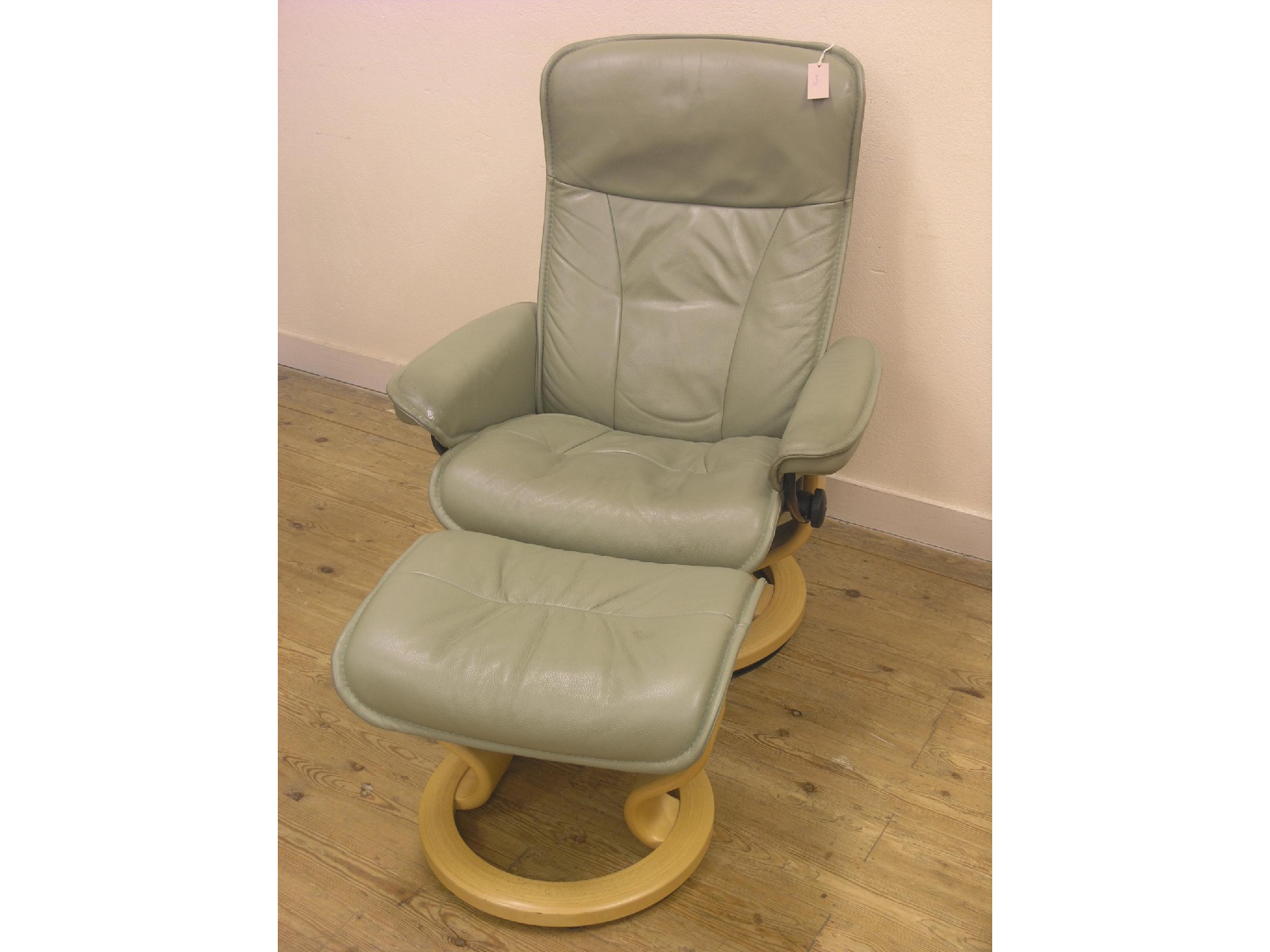 Appraisal: A modern recliner armchair upholstered in a medium green leather