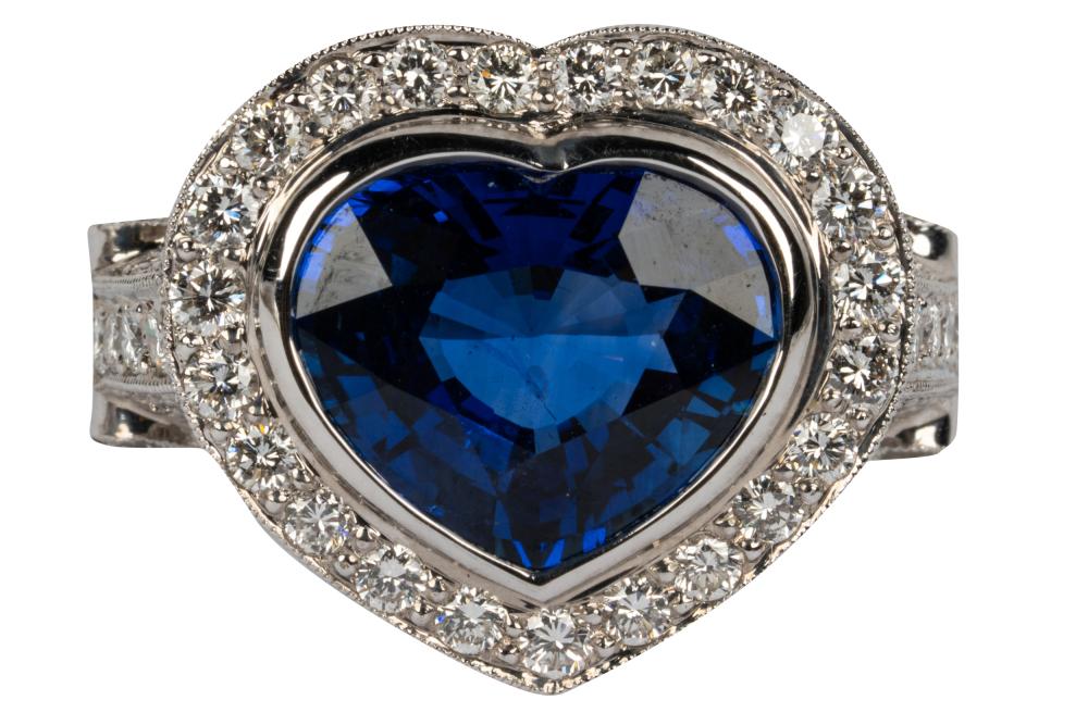 Appraisal: KARAT WHITE GOLD DIAMOND HEART SAPPHIRE RINGcentering one heart shape