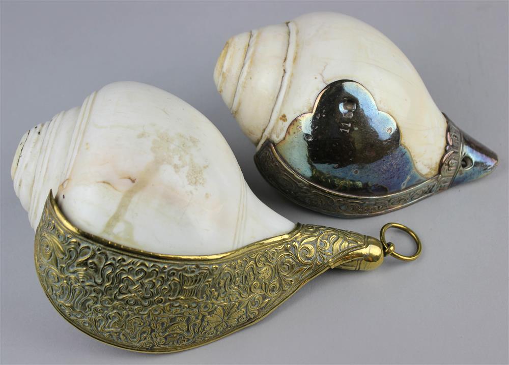 Appraisal: TWO SILVERED METAL MOUNTED SINO-TIBETAN OR MONGOLIAN RITUAL CONCH SHELLS