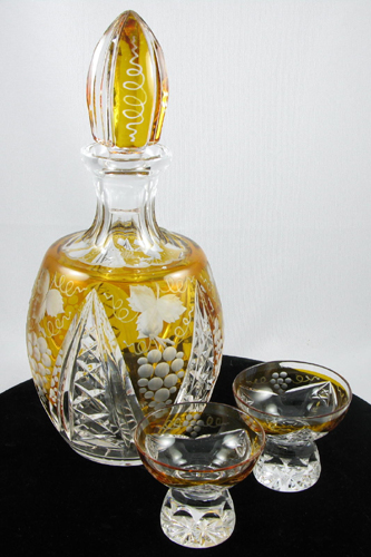 Appraisal: A THREE PIECE LIQUEUR SET in amber and clear cut