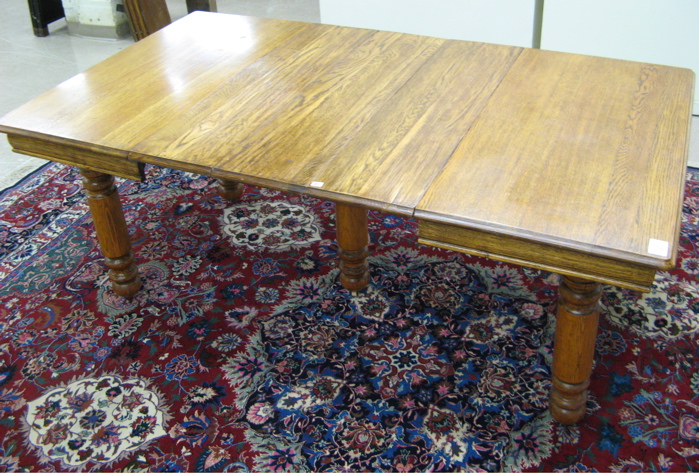 Appraisal: SQUARE OAK DINING TABLE WITH EIGHT LEAVES American c the