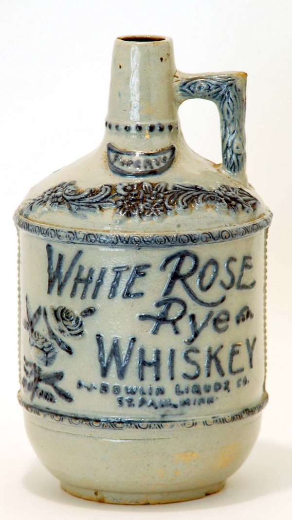 Appraisal: White Rose Rye Whiskey stoneware advertising jug Cobalt raised floral