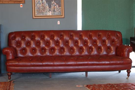 Appraisal: An English Leather Club Sofa with brass studding and button