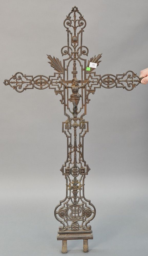 Appraisal: Large metal cross with pierced scrolling motif and crucified Christ