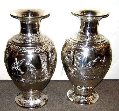 Appraisal: PAIR OF PLATED SILVER BALUSTER VASES Each footed decorated with