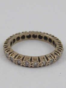 Appraisal: A yellow metal tests high carat gold diamond eternity ring