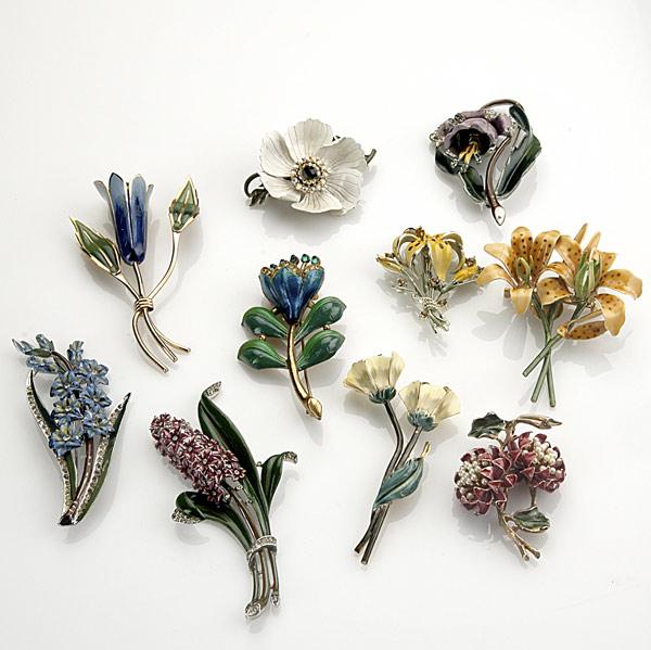 Appraisal: ENAMELED METAL FLOWER BROOCHES Ten pieces mid th C include