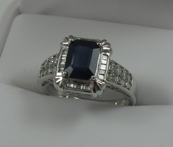 Appraisal: SAPPHIRE DIAMOND AND FOURTEEN KARAT GOLD RING with appraisal Centering