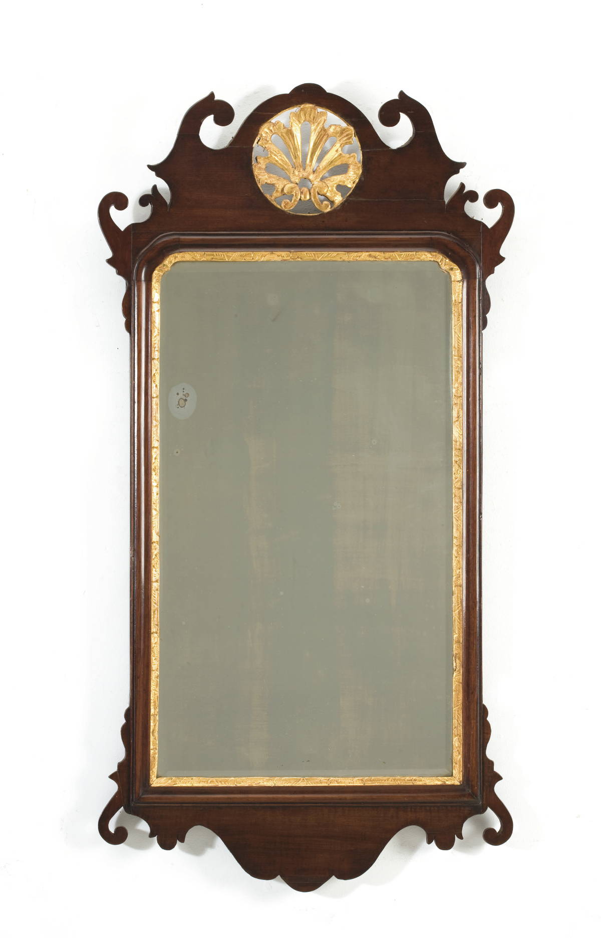 Appraisal: CHIPPENDALE MAHOGANY AND PARCEL GILT MIRROR WITH CARVED SHELL CREST