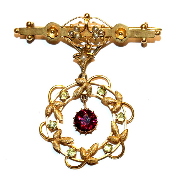 Appraisal: A VICTORIAN GARNET PEARL AND PERIDOT BROOCH wirework and beaded