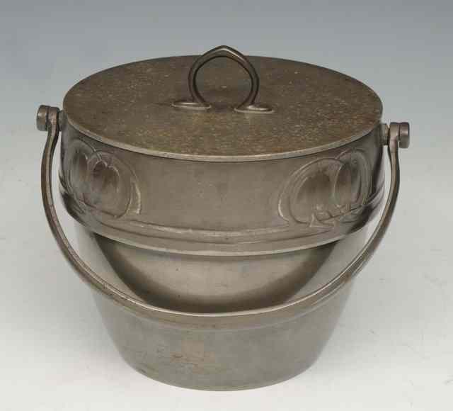 Appraisal: AN ART NOUVEAU PEWTER BISCUIT BARREL with loop handle after