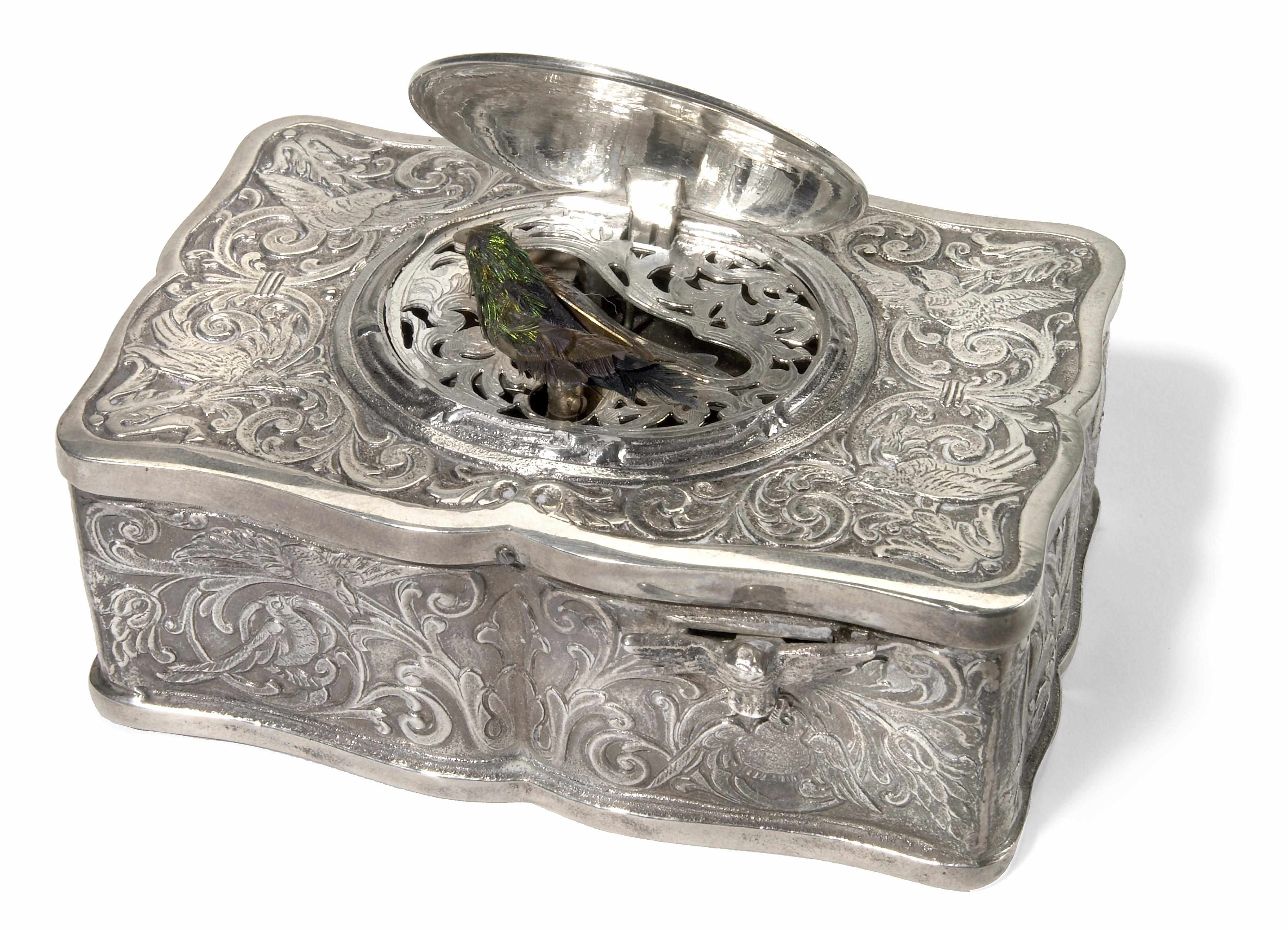 Appraisal: A German sterling silver singing bird music box th century