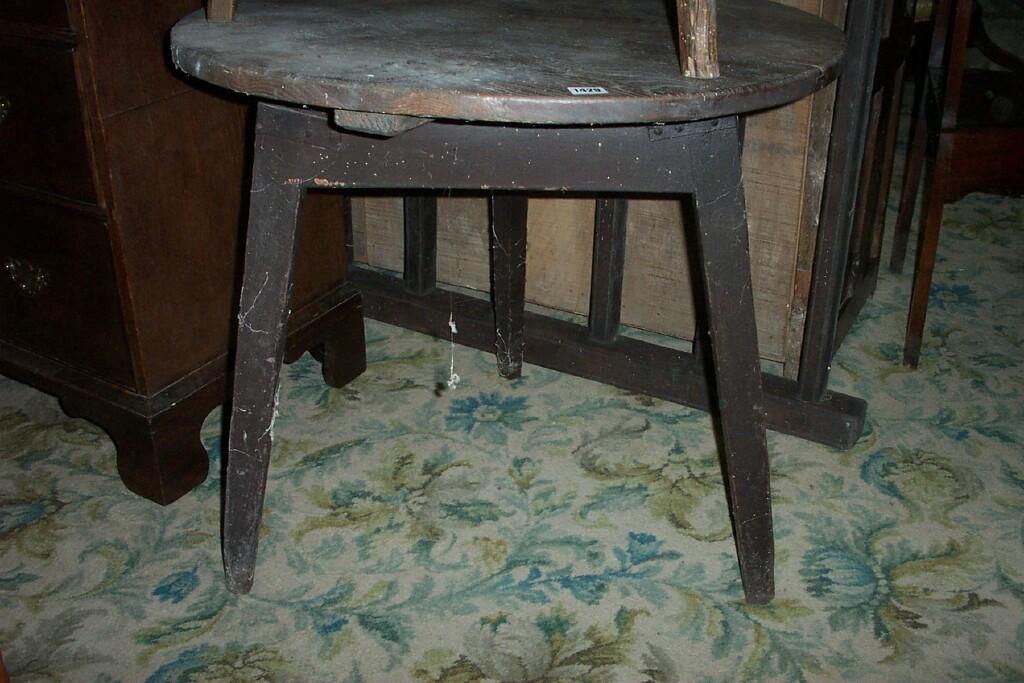 Appraisal: A Georgian oak cricket table of usual form the circular