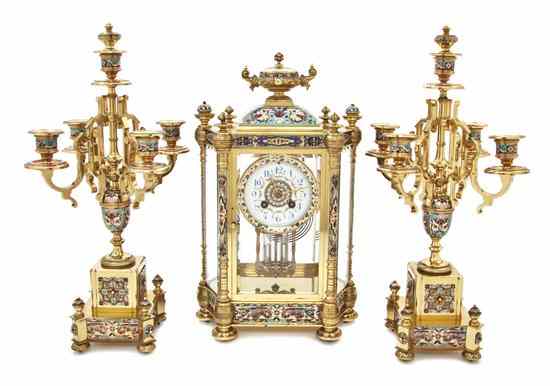 Appraisal: A French Gilt Brass and Champleve Clock Garniture the clock