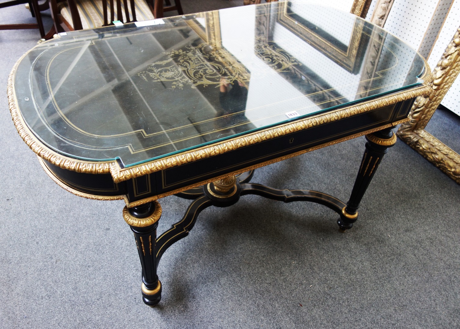 Appraisal: A th century gilt metal mounted ebonised centre table the