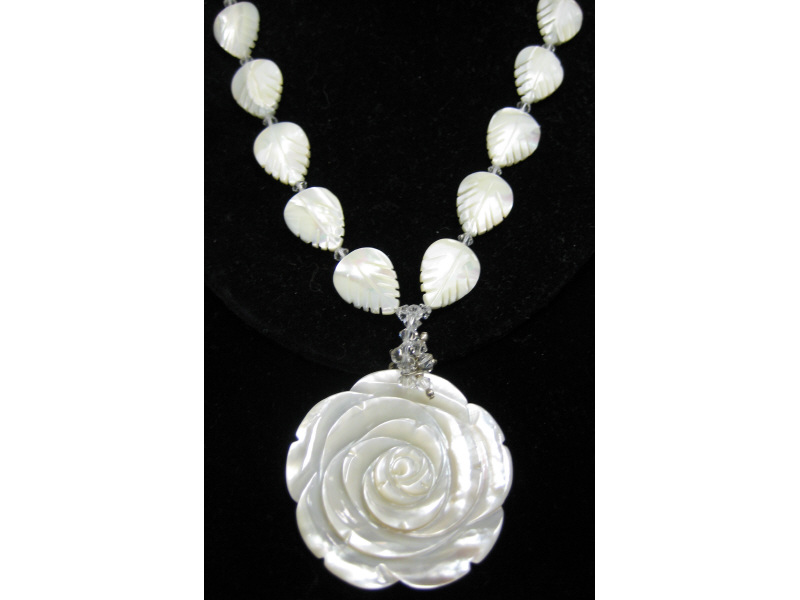 Appraisal: MOTHER OF PEARL NECKLACE Carved rose pendant attached with faceted