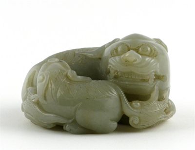 Appraisal: A Chinese celadon jade carving of two lion dogs probably