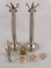 Appraisal: A pair of column candlesticks rising to coronet nozzles and