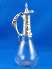 Appraisal: A continental German assay silver mounted lidded liqueur decanter in