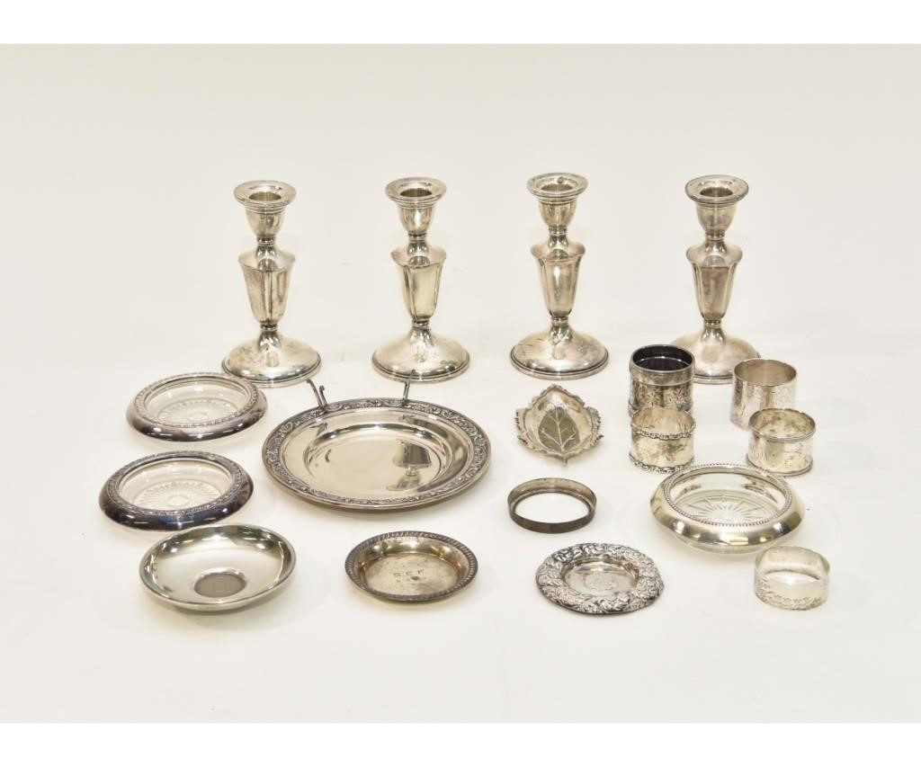 Appraisal: Four weighted sterling silver candlesticks h napkin rings glass and