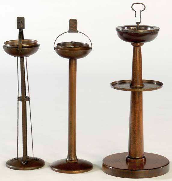 Appraisal: ROYCROFT Three ashtray stands one with mahogany base two in