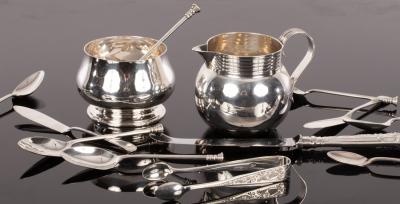 Appraisal: A silver cream jug London with reeded loop handle six