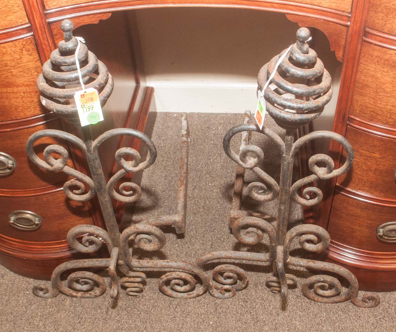 Appraisal: Pair of wrought iron andirons Undernumber