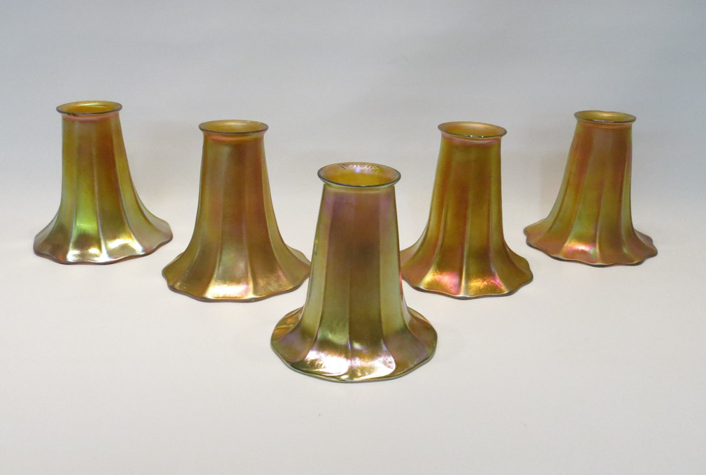 Appraisal: FIVE GOLD IRIDESCENT ART GLASS SHADES each ribbed trumpet form