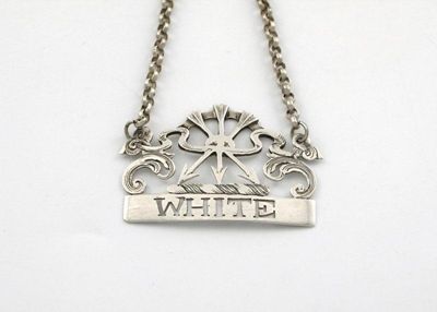 Appraisal: A late th century wine label pierced 'WHITE' surmounted by