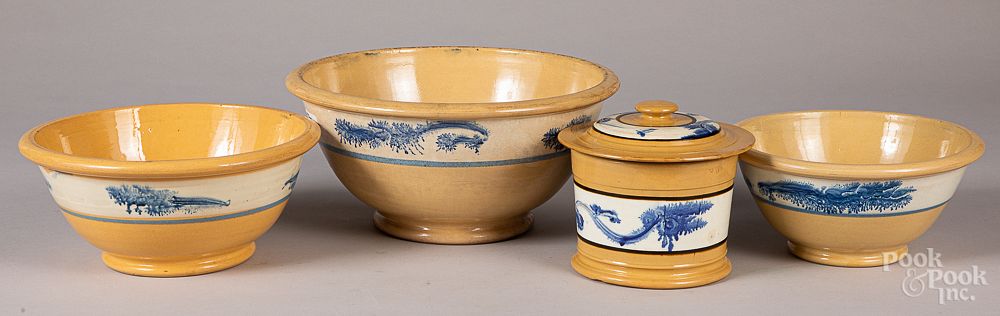 Appraisal: Three yellowware mixing bowls Three yellowware mixing bowls with seaweed