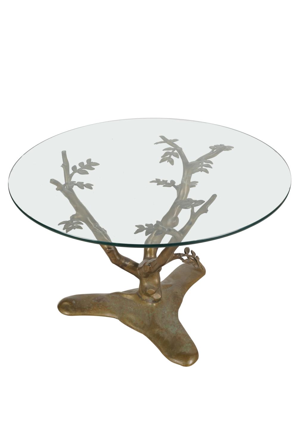 Appraisal: BRASS TREE BRANCH-FORM COFFEE TABLEwith round glass top and patinated