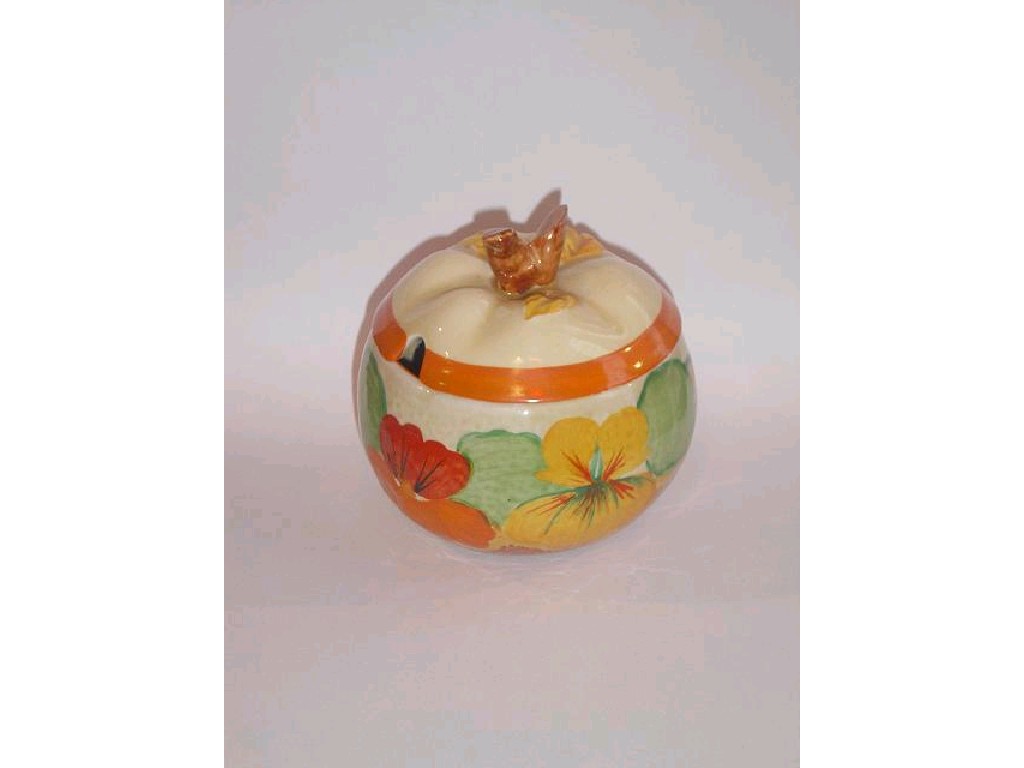 Appraisal: A Clarice Cliff Bizarre jam pot and cover in the