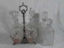 Appraisal: A triple silver plated wine decanter stand with cut glass