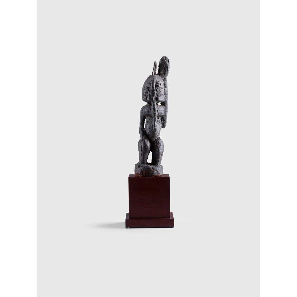 Appraisal: DOGON TELLEM FIGURE MALI carved wood standing on an integral