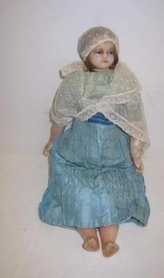 Appraisal: A poured wax shoulder head doll with blue glass eyes