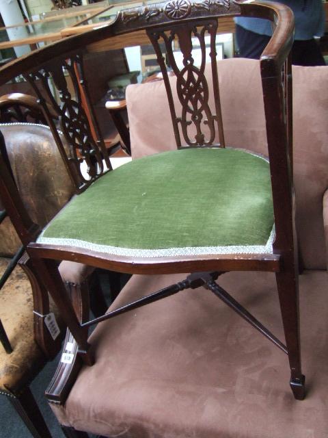 Appraisal: An Edwardian mahogany tub chair with triple pierced back raised