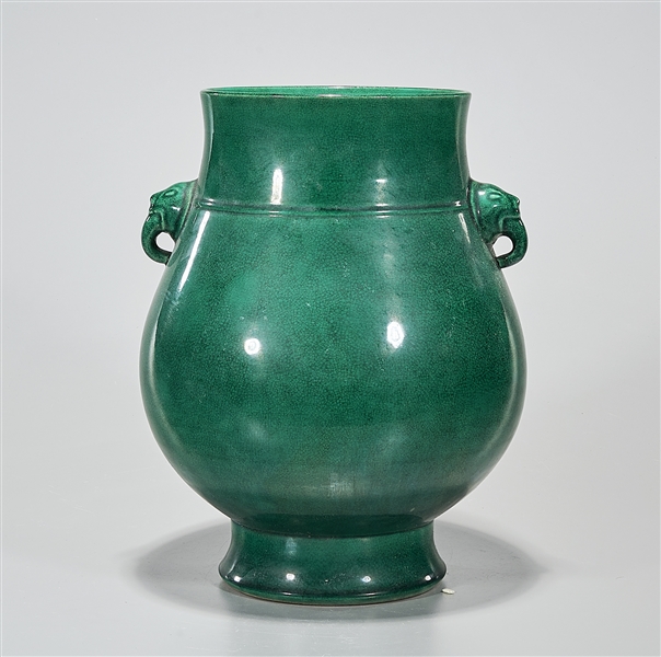 Appraisal: Chinese green crackle glazed porcelain vase beast head handles to