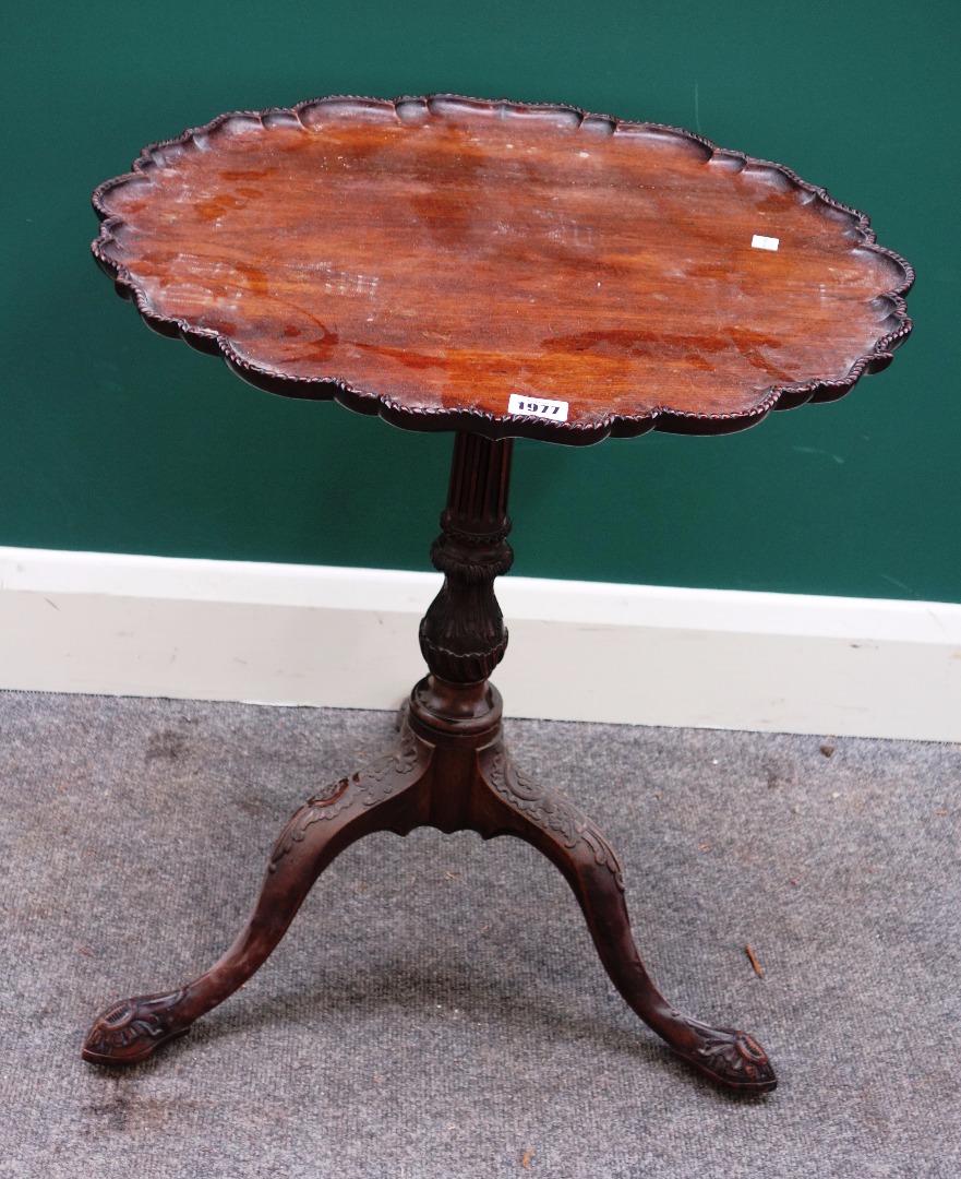 Appraisal: A Victorian extensively carved mahogany tripod occasional table cm wide