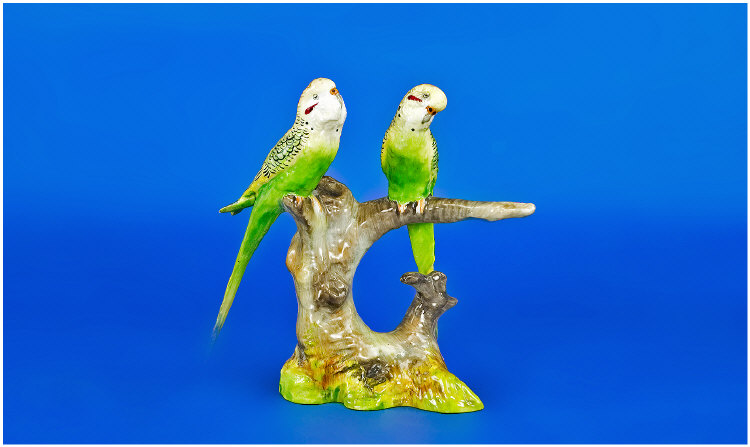 Appraisal: Staffordshire Pair of Budgie Figures sitting on a branch Signed