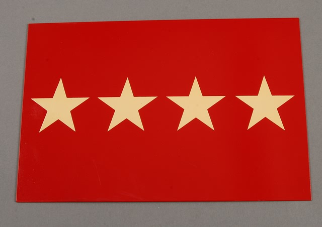 Appraisal: Red license plate presenting four stars Plate measures x Minor